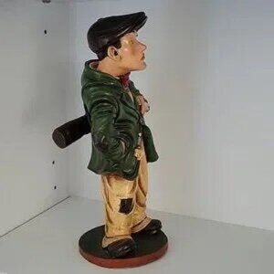 VINTAGE, "PETER MOOK", RESIN STATUE OF A GOLFER CADDYSTATUE.